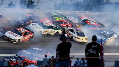 NASCAR halts Atlanta Cup race after huge crash collects half the field