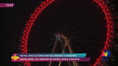Papai Noel desce de rapel na roda-gigante de Balneário Camboriú